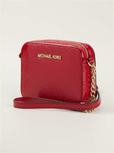 michael kors perforated logo red bag|Michael Kors red crossbody bag.